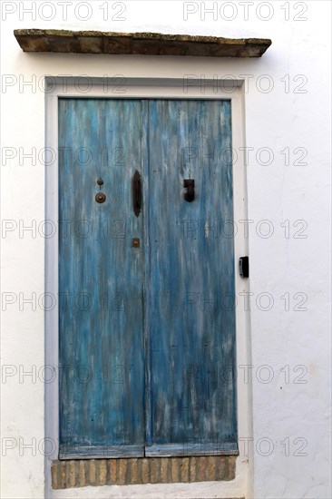 Blue doorway traditional whitewashed buildings in Vejer de la Frontera, Cadiz Province, Spain, Europe