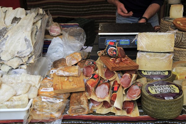 Display of fish, meat and cheese products on market stall, Algeciras, Spain, Europe