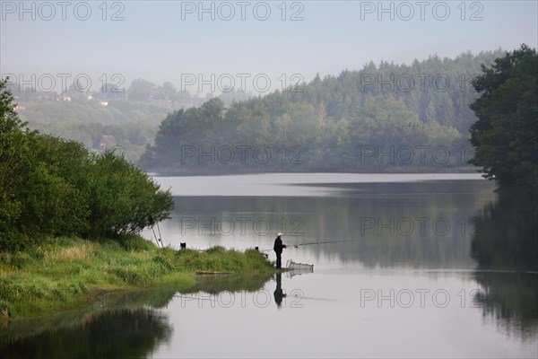 Angler at the Buetgenbach reservoir in the Hautes Fagnes, High Fens, Ardennes, Belgium, Europe