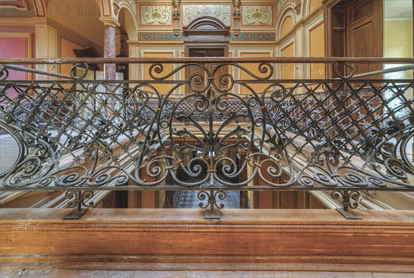 Detailed wrought-iron railing on an elegant staircase with wooden steps, Villa Woodstock, Lost Place, Wuppertal, North Rhine-Westphalia, Germany, Europe