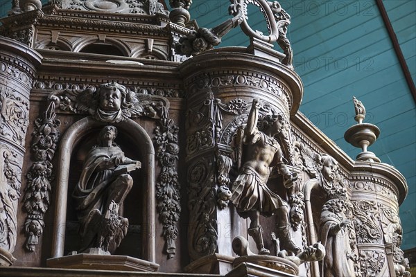 Renaissance-style carved canopy of the baptismal font, Enclos Paroissial enclosed parish of Guimiliau, Finistere Penn ar Bed department, Brittany Breizh region, France, Europe