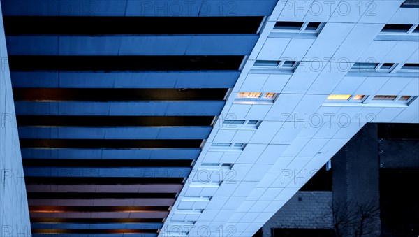 Illuminated rooms in a tower block in Gropiusstadt. The rise in rents in German cities has increased again in the past year, Berlin, 16.01.2023