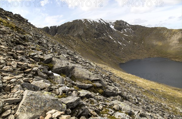 Striding Edge arete Helvellyn mountain peak and Red Tarn corrie lake, Lake District, Cumbria, England, UK