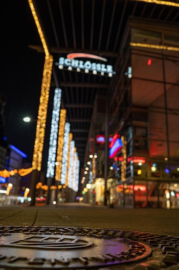 Shallow depth of field shows city lights and neon signs at night, Schloessle Galerie, Pforzheim, Germany, Europe