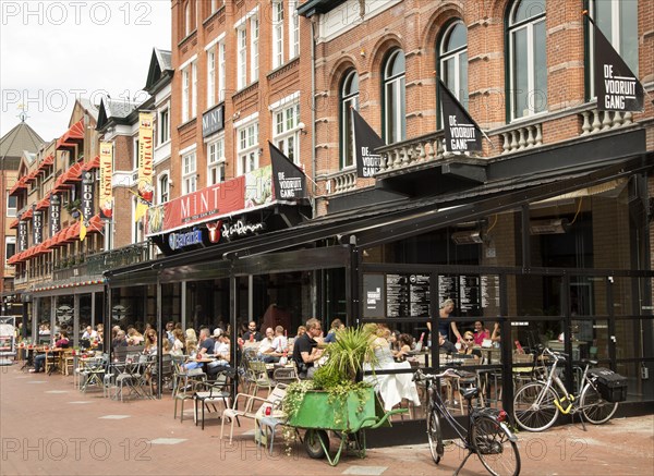 People sitting at street cafes, Eindhoven city centre, North Brabant province, Netherlands