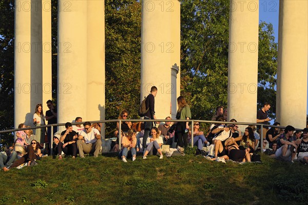 People enjoying the autumn sun at the Monopteros in the English Garden, Munich, Bavaria, Germany, Europe