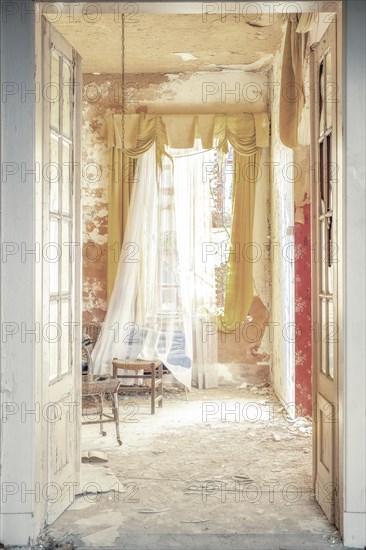 View through an open door to an empty room with torn curtains and dilapidated walls, urologist's villa Dr Anna L., Lost Place, Bad Wildungen, Hesse, Germany, Europe