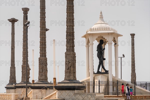 Child at the foot of a Mahatma Gandhi monument, statue, former French colony of Pondicherry or Puducherry, Tamil Nadu, India, Asia