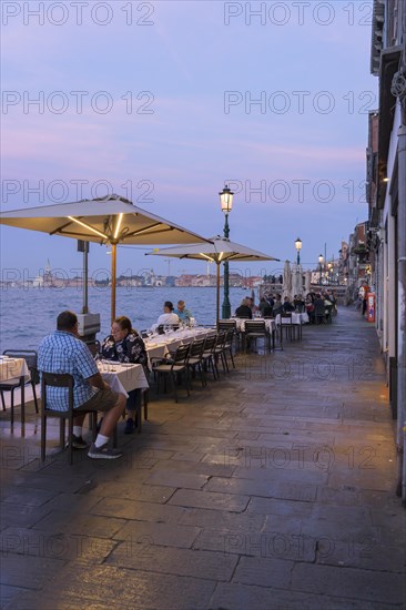 Restaurant on the waterfront of the Guidecca Canal, Dorsoduro district, Venice, Veneto, Italy, Europe