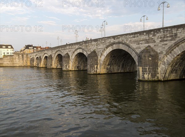 Evening light historic bridge, River Maas or Meuse, Maastricht, Limburg province, Netherlands