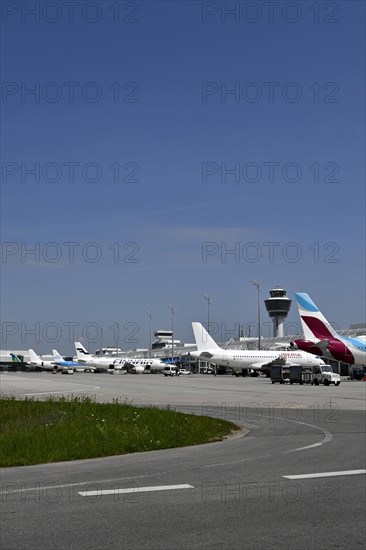 Overview Eurowings, Iberia, Finnair, KLM and Air Lingus aircraft at check-in position at Terminal 1 with control tower, Munich Airport, Upper Bavaria, Bavaria, Germany, Europe