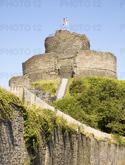 Cornish and English Heritage flags over the castle, Launceston, Cornwall, England, UK