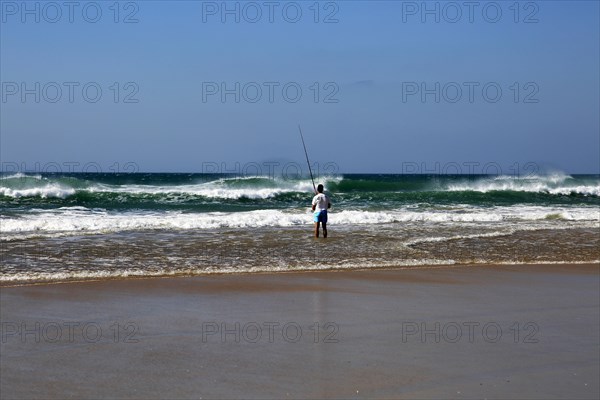 Man fishing from the beach at Conil de la Frontera, Cadiz province, Spain, Europe