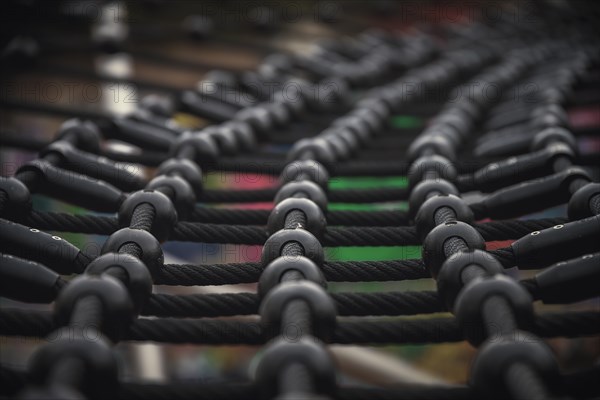 Detailed view of a rope net on a children's playground with bokeh effect, Wuppertal Elberfeld, North Rhine-Westphalia, Germany, Europe