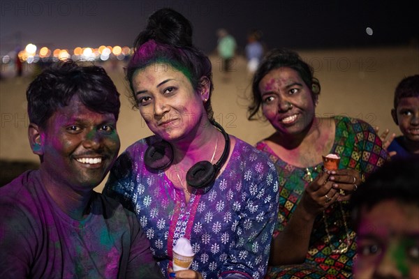 Young people, Holi Festival, Indian spring festival, traditional festival of colours, Marina Beach, Chennai, Tamil Nadu, India, Asia