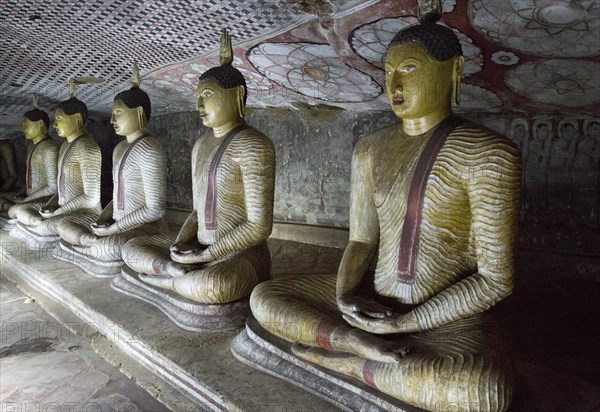 Buddha figures inside Dambulla cave Buddhist temple complex, Sri Lanka, Asia