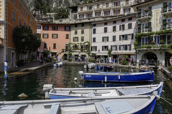Houses and fishing boats in the old harbour of Limone sul Garda, Lake Garda, Province of Brescia, Lombardy, Upper Italy, Italy, Europe