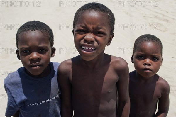 African children, boys, group, global, camera view, gaze, childhood, trio, looking, looking at, Botswana, Africa