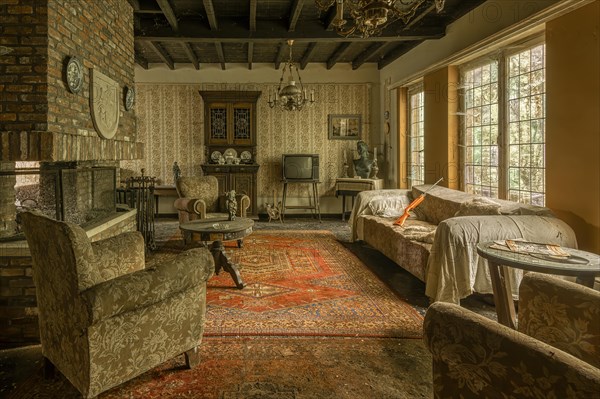 Retro-style living room with furniture, carpet and TV, daylight coming through windows, Maison Limmi, Lost Place, Kalken, Laarne, Province of East Flanders, Belgium, Europe