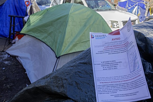 Denver, Colorado, Immigrants, mostly from Venezuela, live in a tent camp near downtown Denver. Notices placed on tents by the city warn migrants that they will have to vacate the area. The city helped about 35, 000 migrants in 2023 with food and temporary shelter, but more continue to arrive daily on buses from the southern border