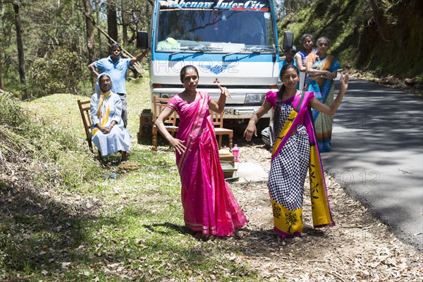 Two young women dancing in traditional saris, near Nuwara Eliya, Sri Lanka, Asia