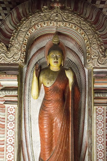 Buddha figure inside Dambulla cave Buddhist temple complex, Sri Lanka, Asia