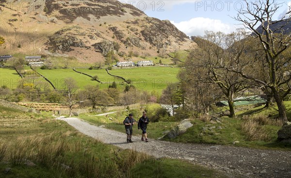 Two people walking, Glenridding, Lake District, Cumbria, England, UK