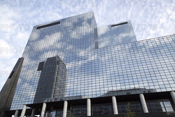 High rise modern glass office block buildings reflecting clouds, Rotterdam, Netherlands