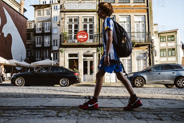 April 17, 2023, Porto, Portugal: People commuting, tourists relaxing, enjoying and sightseeing downtown of Porto
