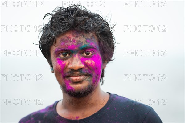 Man with colour on his face, Holi Festival, Indian spring festival, traditional festival of colours, Pondicherry or Puducherry, Tamil Nadu, India, Asia