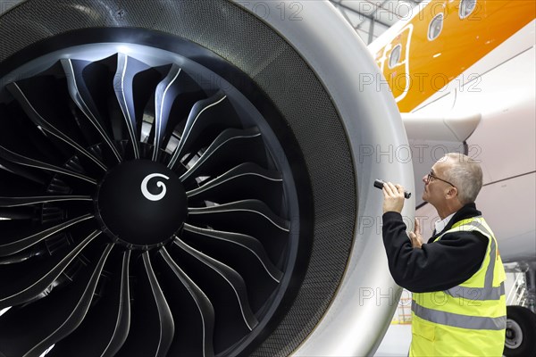 Olaf Gross, Licence Engineer at easyJet, checks the engine of an Airbus A320 Neo in front of the opening of the new easyJet maintenance hangar at Berlin Brandenburg Airport, BER. The entire European easyJet fleet is maintained at the Schoenefeld site