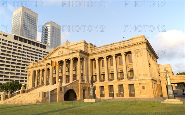 Old Parliament Building now the Presidential Secretariat offices, Colombo, Sri Lanka and modern skyscraper buildings