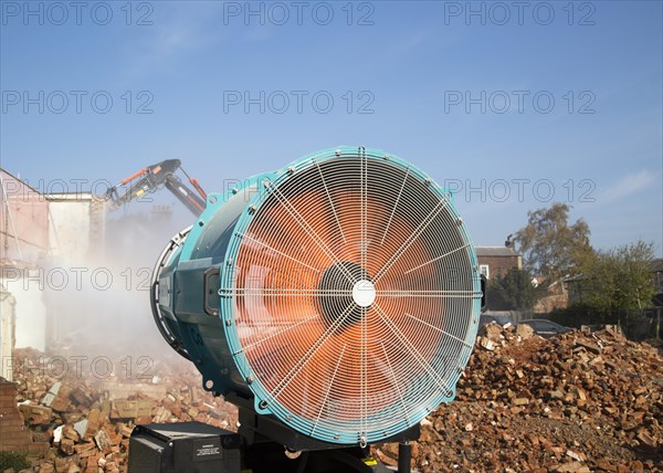 Dehaco water cannon sprayer dampening dust at a demolition site, Woodbridge, Suffolk, England, UK