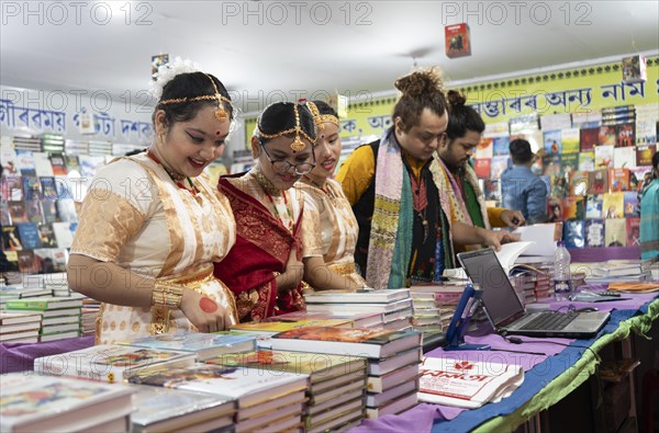 Book readers browsing books at a stall during Assam Book Fair, in Guwahati, Assam, India on 29 December 2023