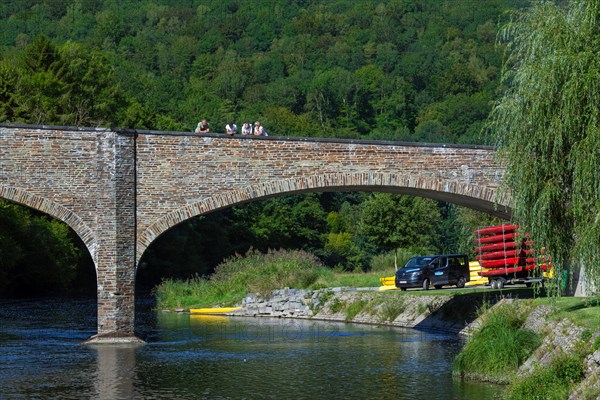 Bridge with tourists looking over the Semois river in summer at the village Vresse-sur-Semois, province of Namur, Belgian Ardennes, Wallonia, Belgium, Europe