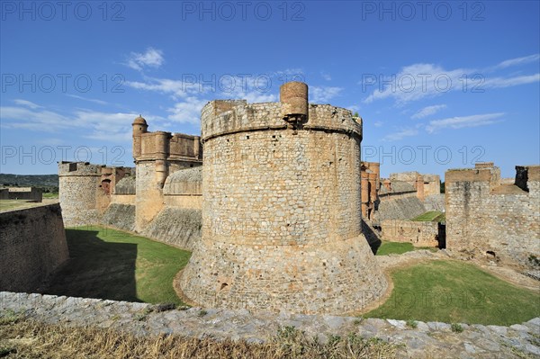 Moat and ramparts of the Catalan fortress Fort de Salses at Salses-le-Chateau, Pyrenees, France, Europe