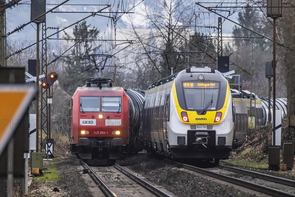 Railway line near Stuttgart with regional train from bwegt, SWEG. RBH Logistics goods train, class BR145 locomotive, Stuttgart, Baden-Wuerttemberg, Germany, Europe