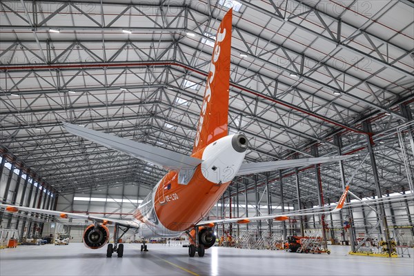 An easyJet Airbus A320 neo stands in the newly opened easyJet maintenance hangar. The entire European easyJet fleet is now maintained at the Schoenefeld site, 11.01.2023