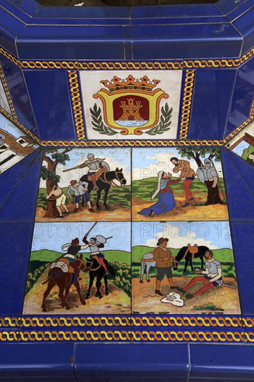 Ceramic tiles on street furniture seat scenes from Cervantes Don Quixote story, Algeciras, Spain, Europe