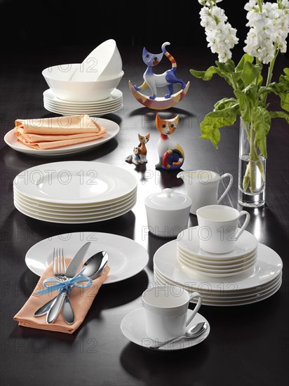 Plates, cups, cutlery, table decoration