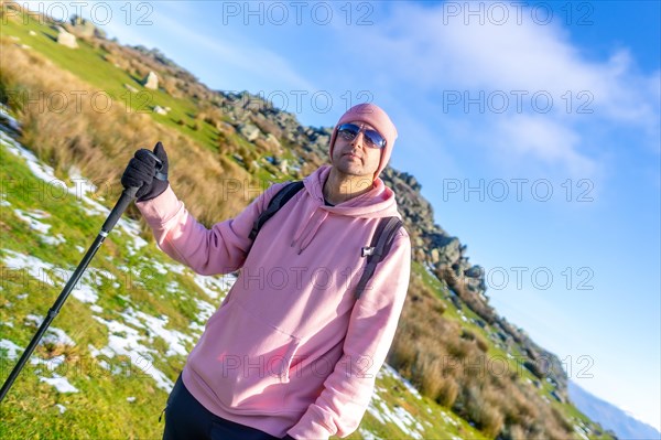Portrait of a man on the top of the mountain when trekking