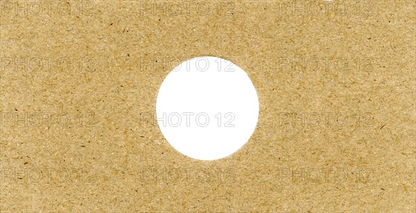 Brown cardboard texture background with hole