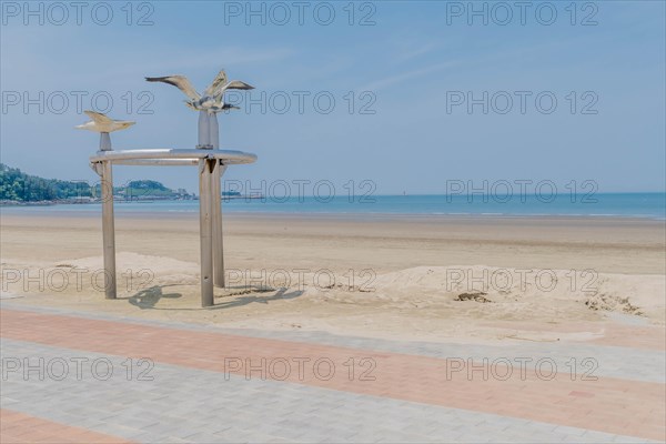 Metal artwork of seagull flying at Chunjangdae beach in South Korea