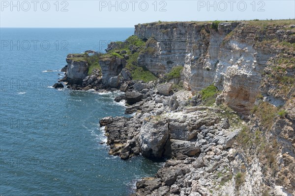 Picturesque cliffs with eroded rock formations on the edge of the sapphire blue sea, cliffs, Kamen Bryag, Bryag, stone shore, Dobrich, Bulgaria, Europe