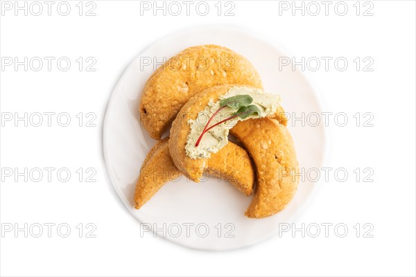 Homemade salted crescent-shaped cheese cookies isolated on white background. top view, flat lay
