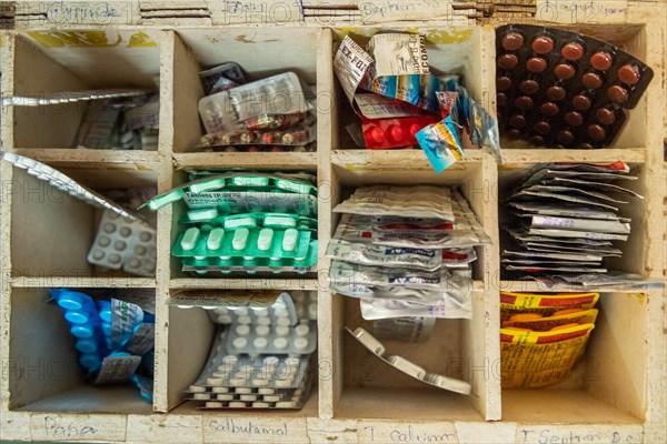 Tablets in a wooden box with compartments, rural health centre, Tamil Nadu, India, Asia