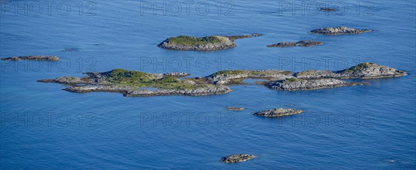 Rocky islands in the blue sea, sea with archipelago islands, Ulvagsundet, Vesteralen, Norway, Europe