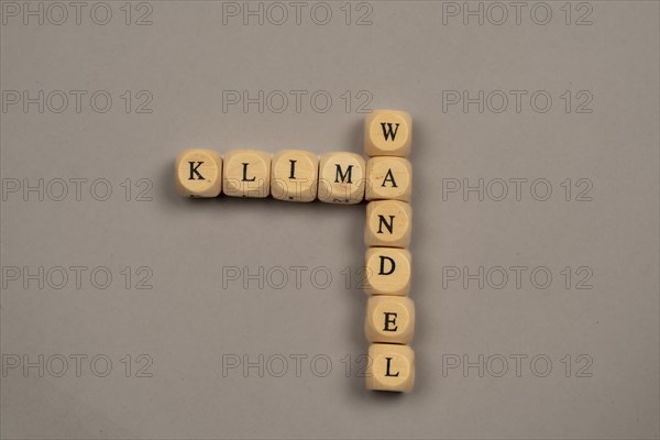 Cubes with letters form the word climate change, light background, top view, studio shot, Germany, Europe