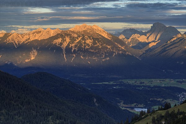 Distant view of steep mountains in the evening light, clouds, autumn, view from Wank to Karwendel Mountains, Werdenfelser Land, Upper Bavaria, Bavaria, Germany, Europe