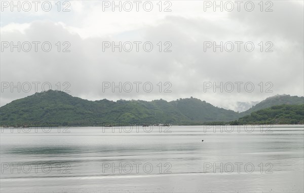 Lombok and Gili Air islands, overcast, cloudy day, sky and sea. Vacation, travel, tropics concept, no people